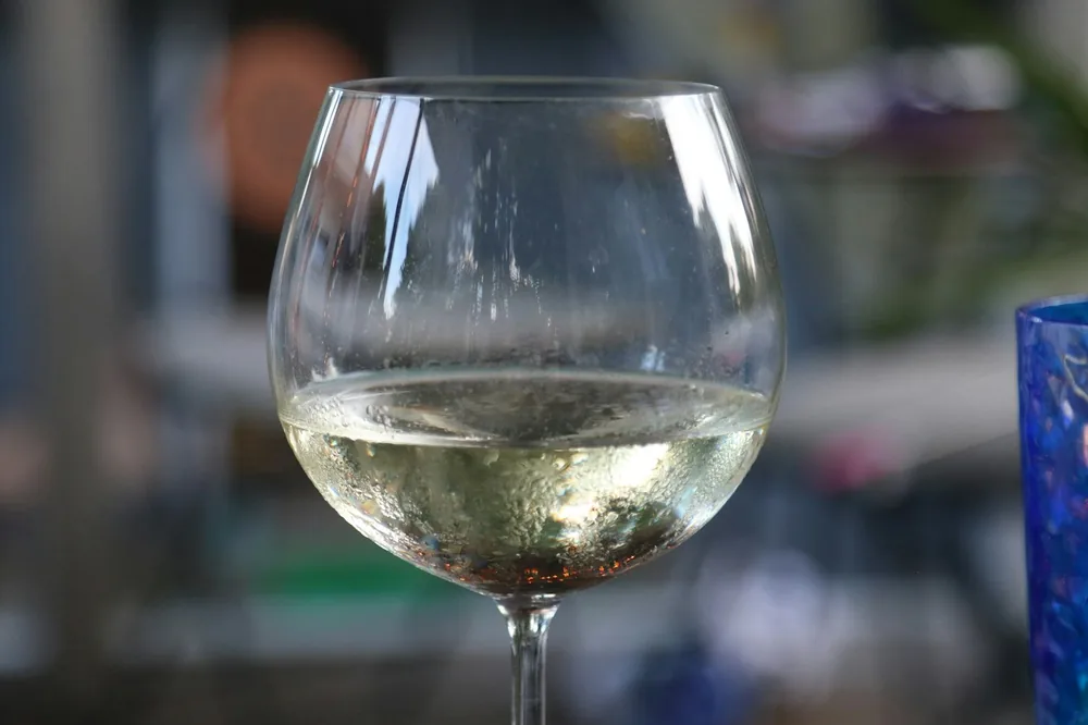 A close up of a wine glass on a table
