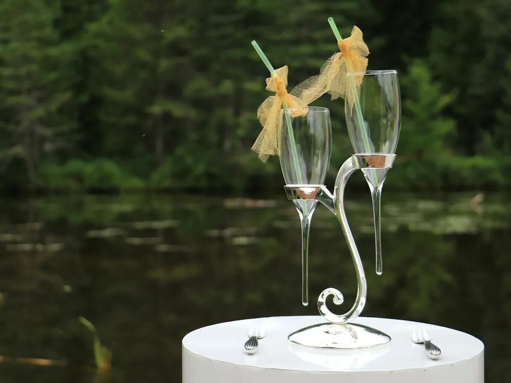 A couple of glasses with yellow liquid in them