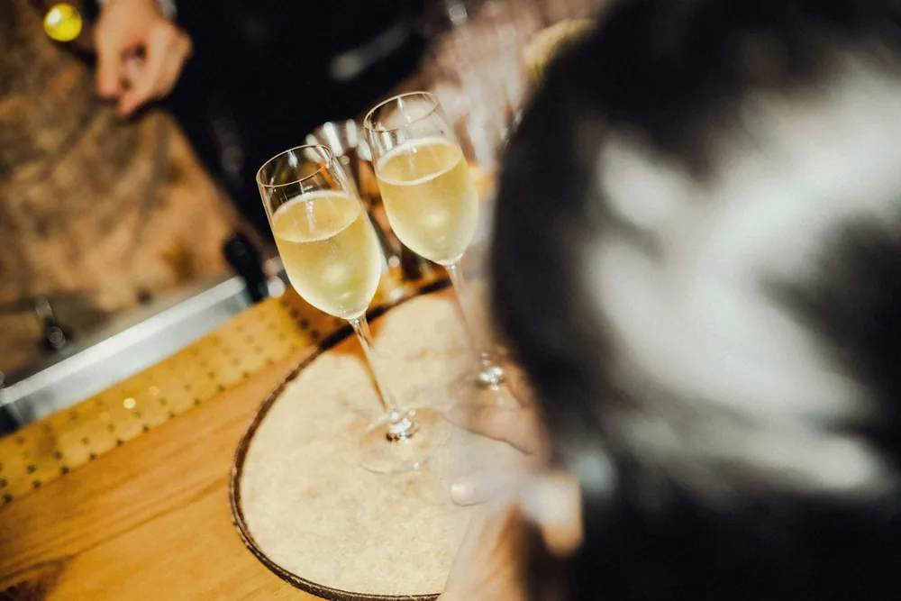 A couple of wine glasses on a table