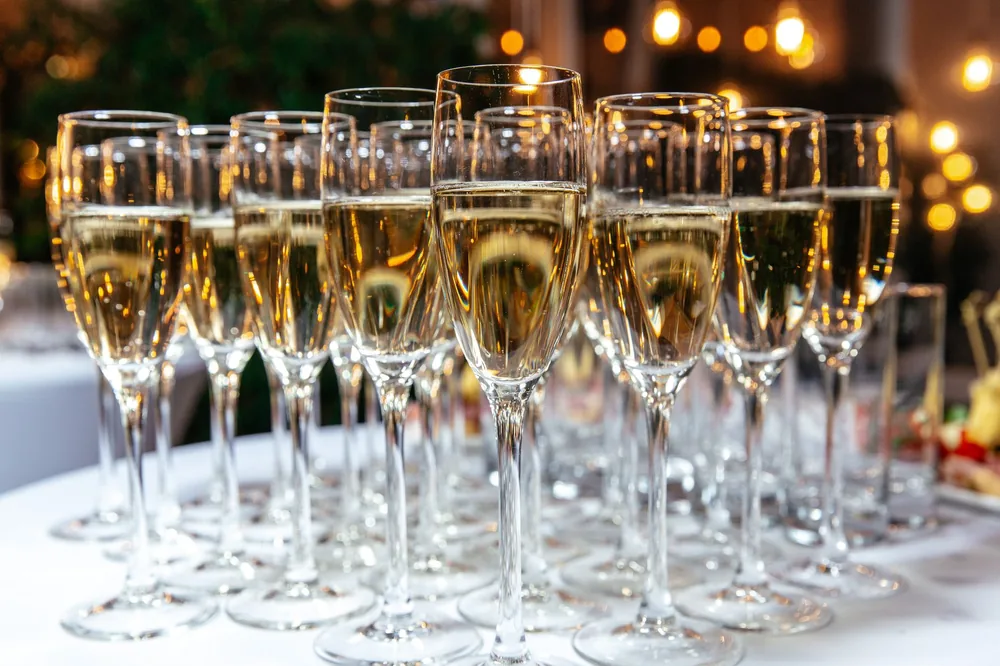A festive arrangement of sparkling wine glasses on a table, perfect for celebrations and events