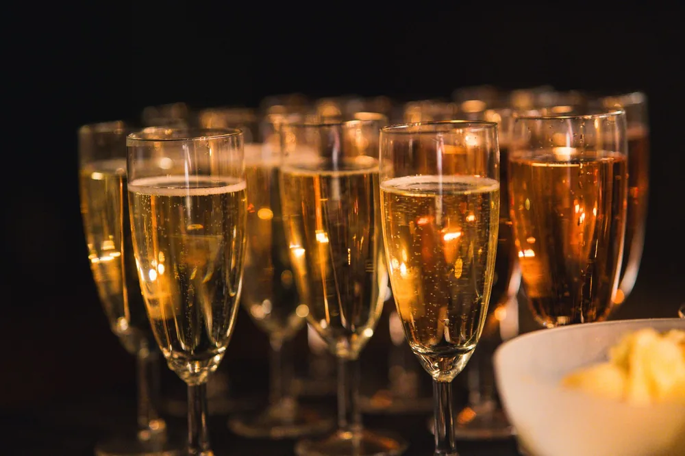 A group of champagne glasses with sparkling bubbles, perfect for a celebration