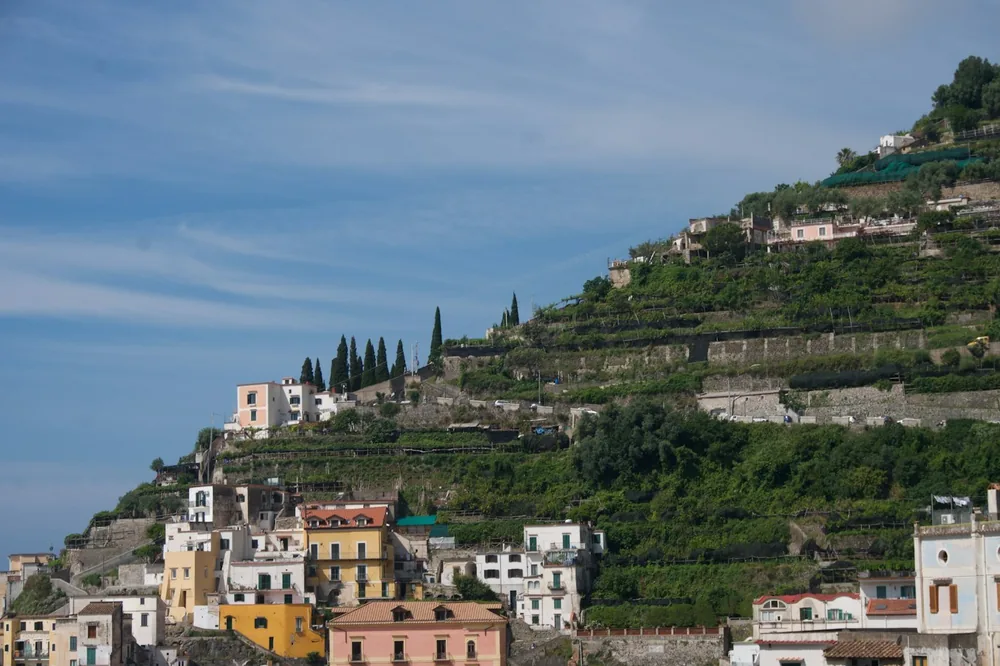 A hill with a bunch of buildings on top of it