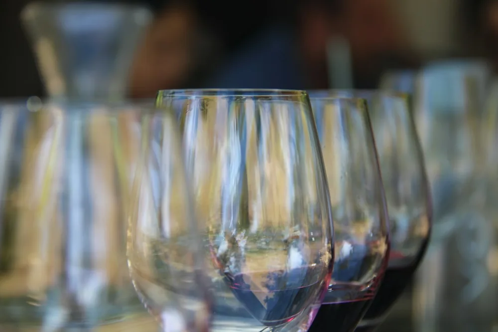 A row of wine glasses sitting on top of a table