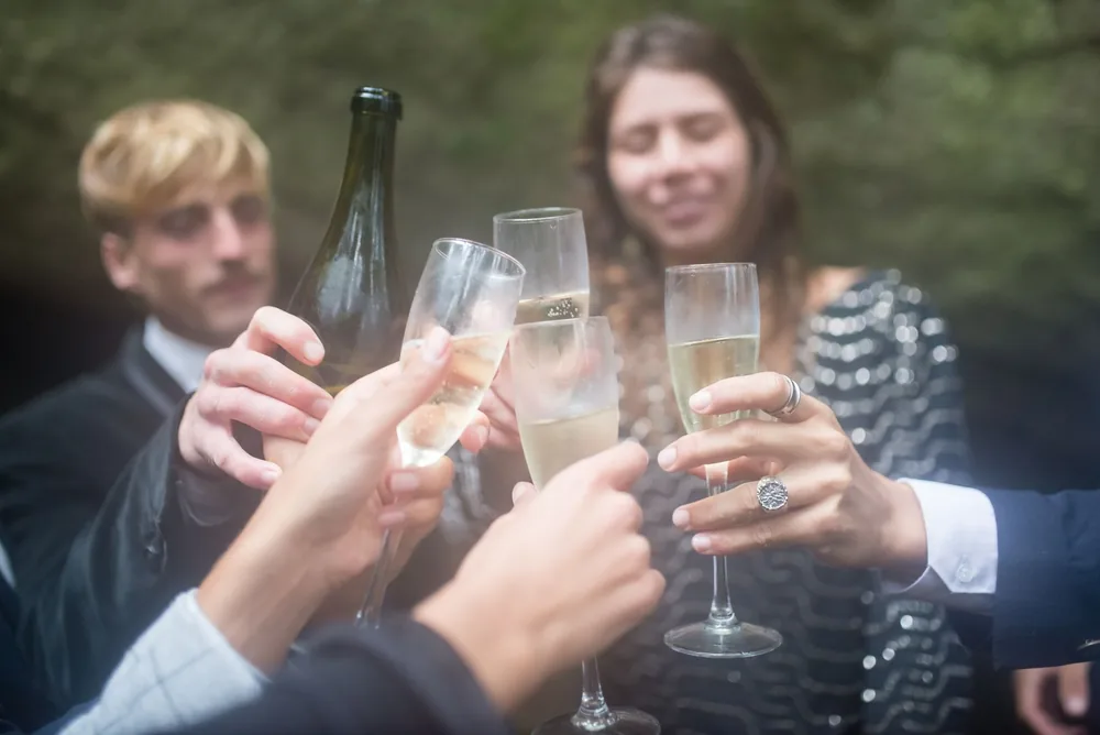 Capturing a joyful toast with champagne glasses during an elegant celebration