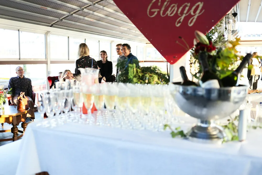 Champagne glasses and bottles on a table at an event