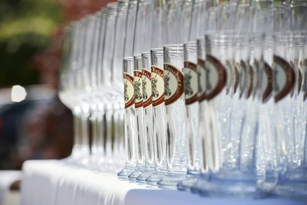 Clear drinking glasses on white table