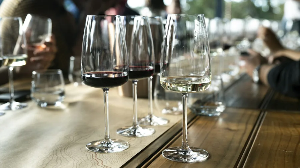 Clear long-stem wine glasses on table