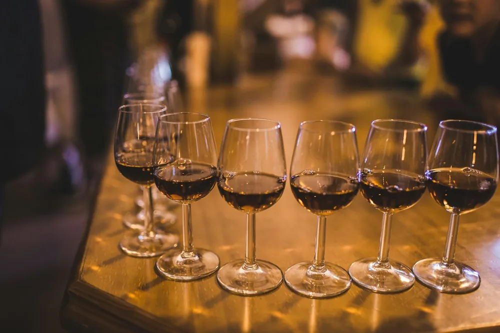 Clear wine glass on brown wooden table