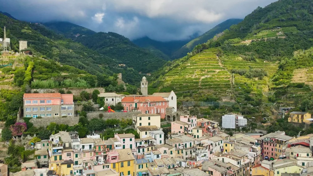 Colorful village nestled in a lush green mountain valley