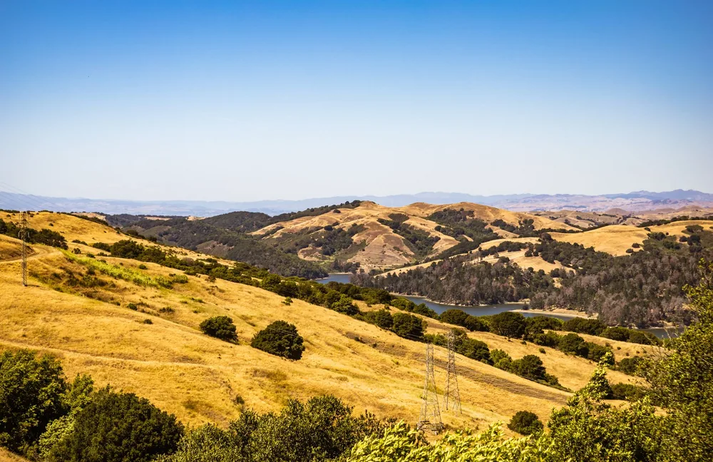 Countryside landscape with rolling hills and blue sky on a sunny day