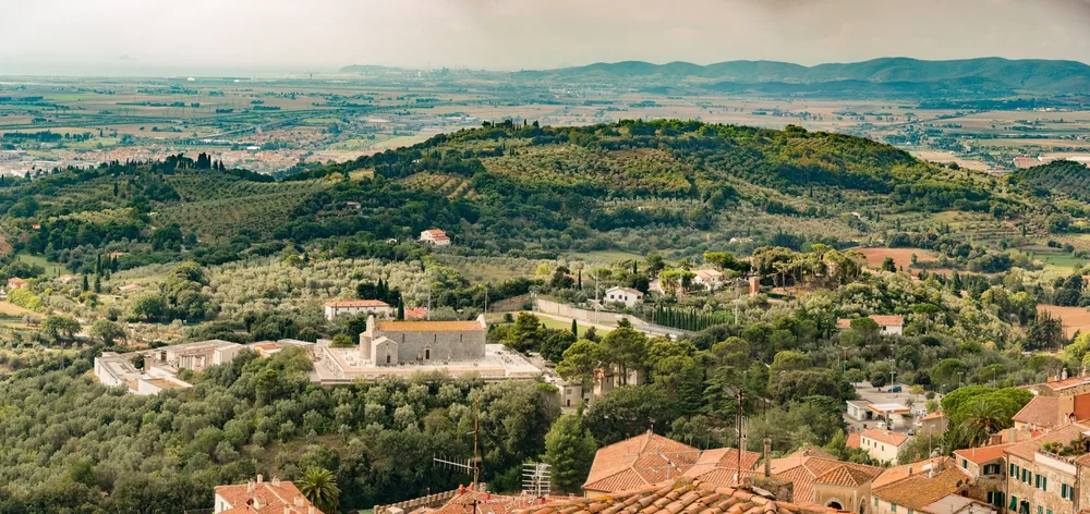 Countryside with lush hills and scattered houses
