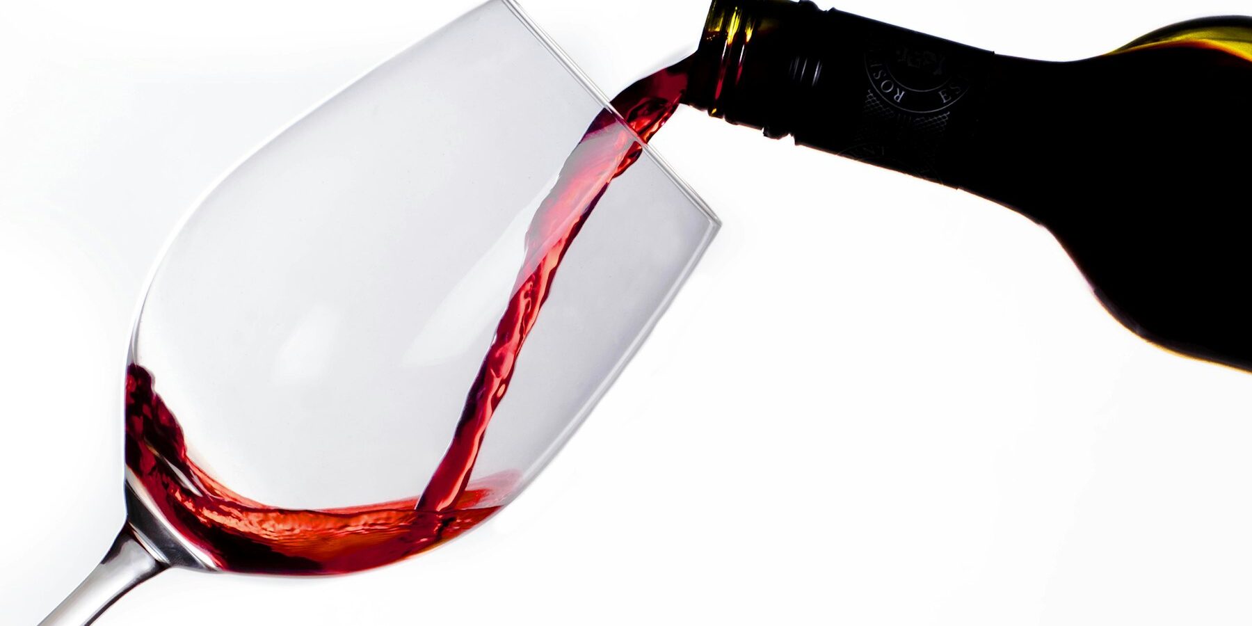 Red wine being poured into a glass
