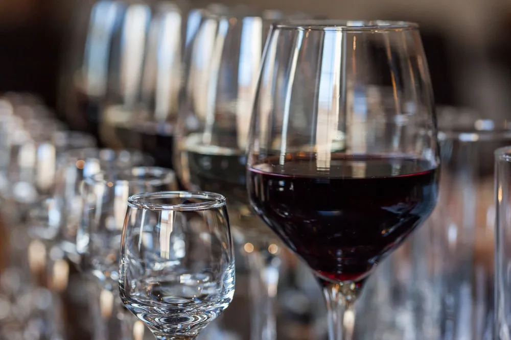 Display of wine glasses in a bar with reflections. Perfect for dining themes