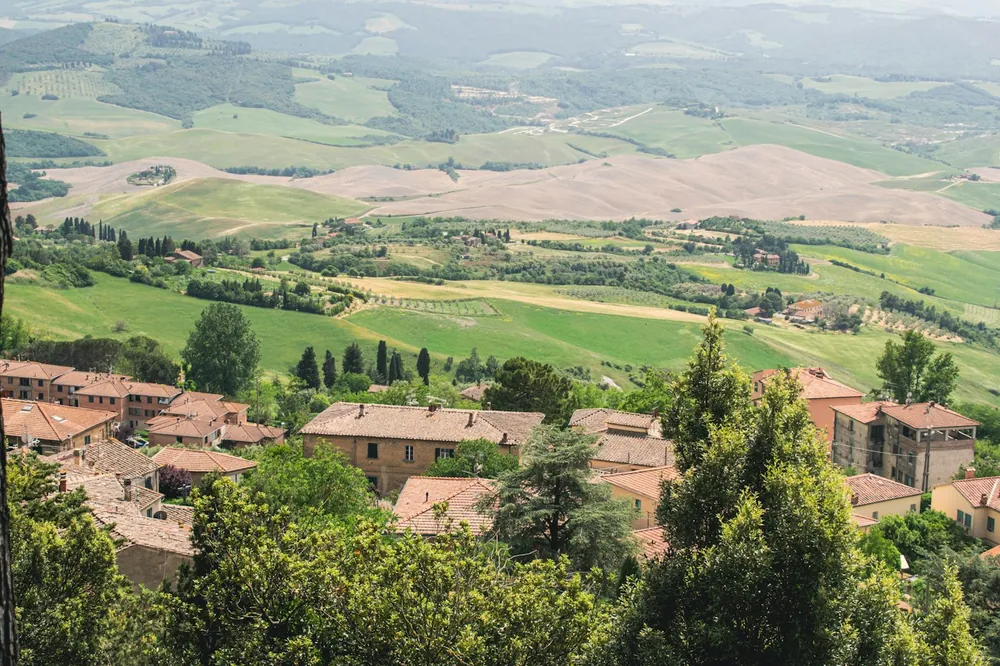 Elevated view of a residential town nestled in rolling hills