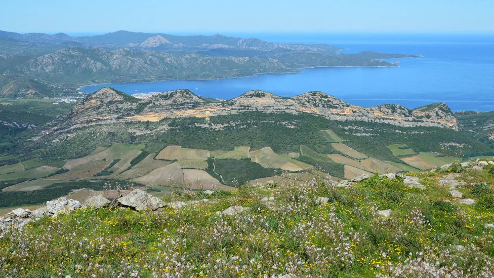 Mountains and coastline under a clear summer sky