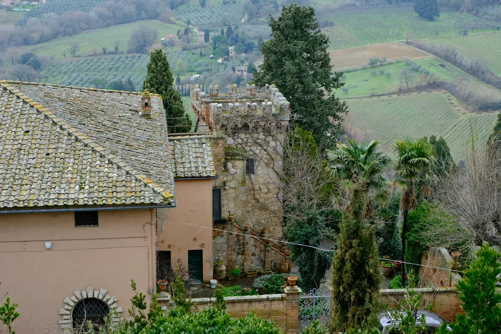 Old stone tower and buildings in a rural landscape