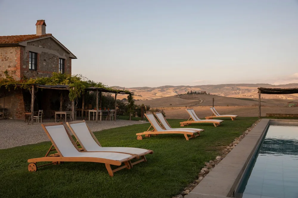 Relaxation by the pool at a scenic countryside retreat with loungers