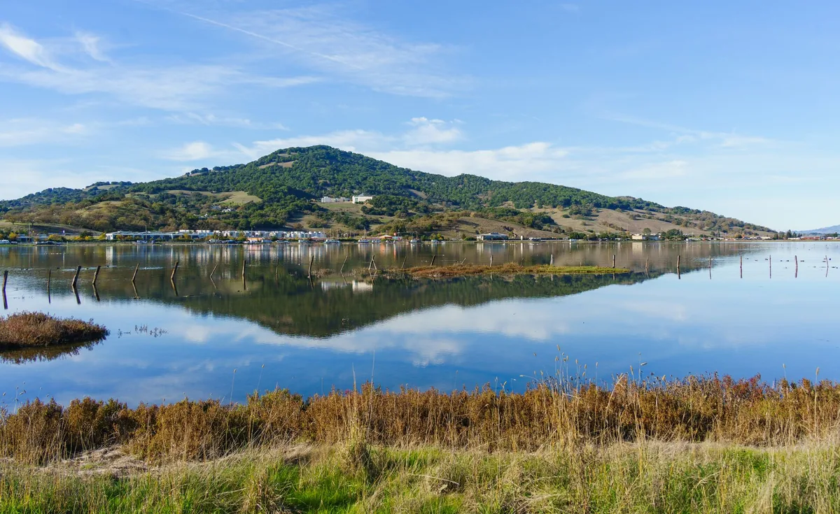 Lake reflecting hills and sky in Sonoma County, California
