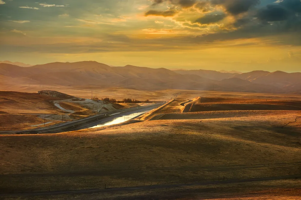 Sunset over the rolling hills of Merced, California, highlighting its natural beauty
