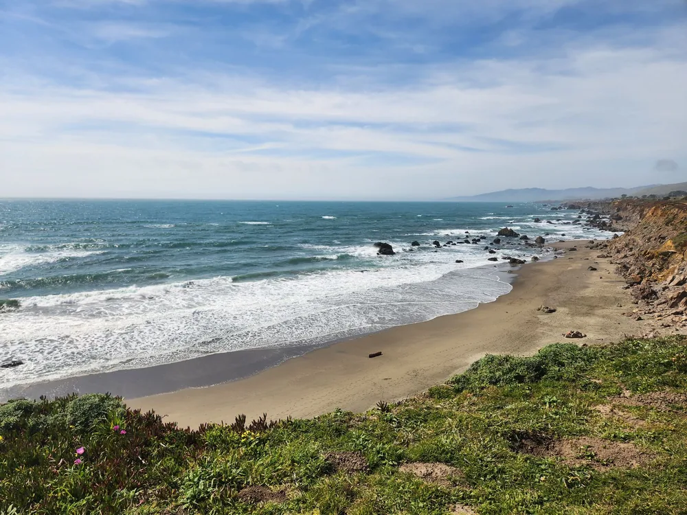 The rocky coastline and sandy beach at Salmon Creek, California