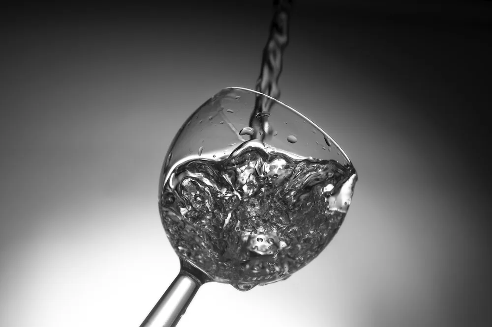 Water poured on wine glass